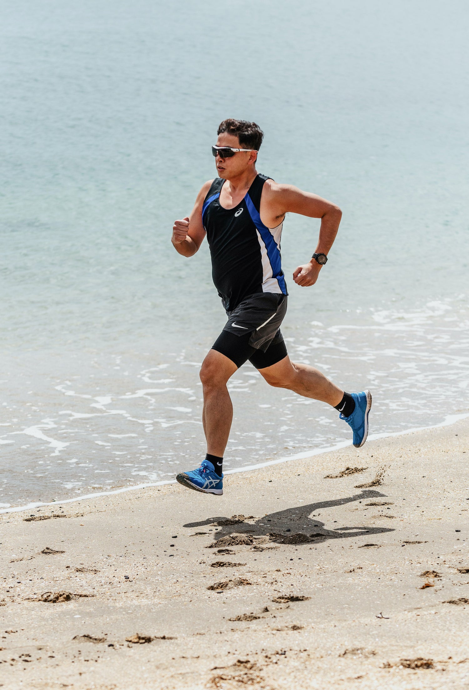 Man running on the beach. Hit your fitness goals with the power of 100% New Zealand blackcurrant extracts. Found in CurraNZ®